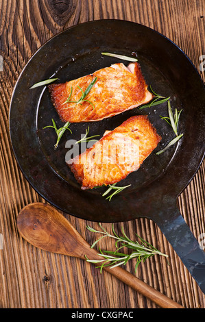 salmon steaks in the iron pan Stock Photo