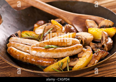 fried sausages with potato mushrooms Stock Photo