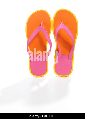 Pair of orange flip flops isolated on white background Stock Photo