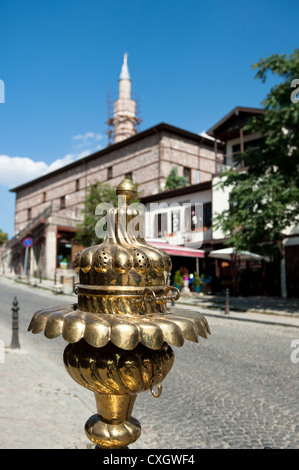 Antique brass on sale in the old town of Ankara in view of the mosque next to the citadel Stock Photo