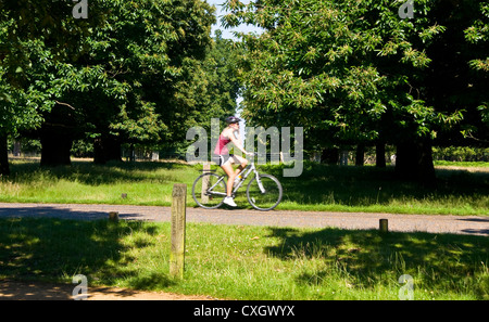 Cyclist passing in front of St Paul's Vista in grade 1 listed Richmond Park London England Europe Stock Photo