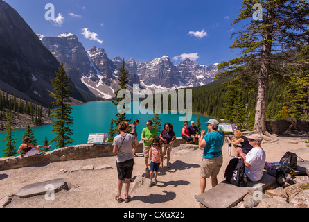 ALBERTA, CANADA - Tourists at Moraine Lake, a glacial lake in Banff National Park. Stock Photo