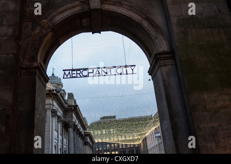 Arch with sign in Glasgow to Merchant City area in Glasgow city centre with a blanket of fairy lights. Stock Photo
