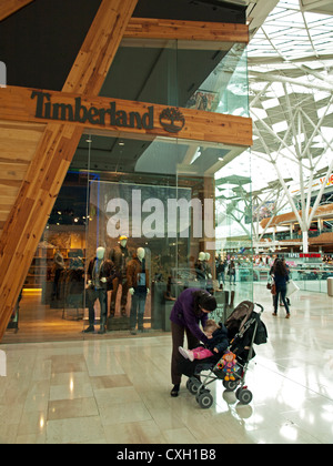 Interior of Westfield Shopping Centre showing Timberland Store, Shepherd's Bush, London, England, United Kingdom Stock Photo