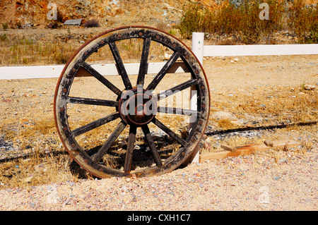 Antique wagon wheel on display in the Wild West town,  from the days of the wild west Seville, Spain Stock Photo