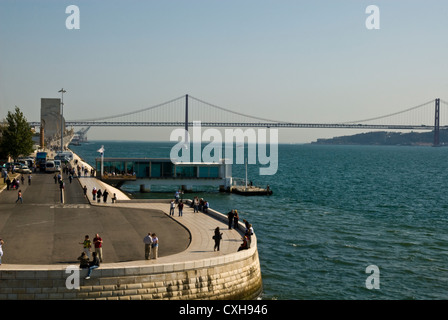 View of the Discoveries monument and 25th April Bridge from Belem Tower, Lisbon, Portugal Stock Photo