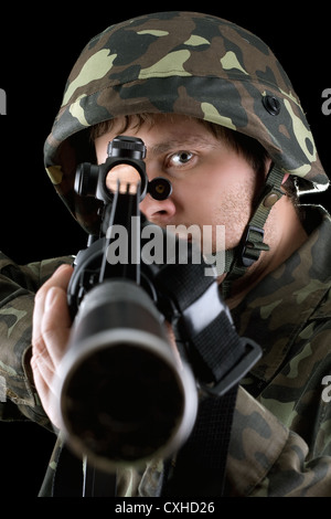 Man pointing a rifle Stock Photo