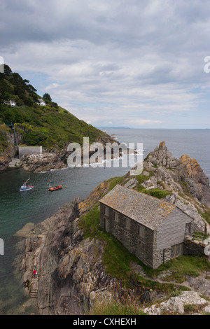 The old net loft on Peak Rock in the fishing village of Polperro, Cornwall, South West United Kingdom Stock Photo