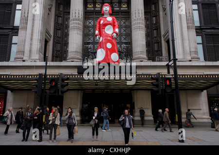 Giant model of Japanese artist Yaoi Kusama life size model in the department store's Oxford Street entrance. Stock Photo