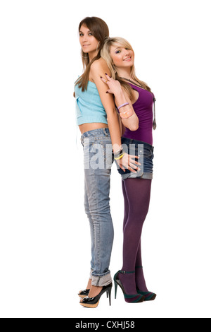 Two attractive young women dressed in trendy alternative clothing