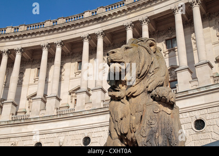 Detail of a lion in front of the Neue Burg in the Heldenplatz, Hofburg, Vienna, Austria. Stock Photo