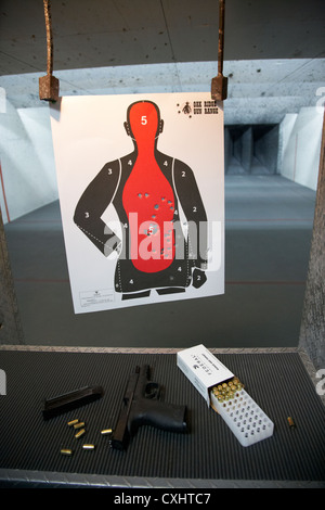 smith and wesson 9mm handgun with ammunition at a gun range in florida usa target shooting handgun training with human shaped paper target Stock Photo