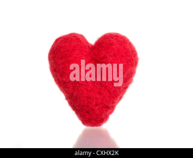 Red heart shape symbol made from wool isolated on white Stock Photo