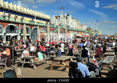 Crowded Brighton seafront on a summers day Stock Photo
