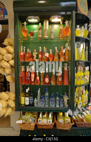 Kumquat and lemon liqueurs for sale in souvenir shop, Old Corfu Town, Kerkyra, Corfu, Ionian Islands, Greece Stock Photo