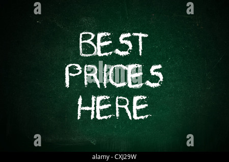 Best prices here, message handwritten with white chalk on a green board. Stock Photo