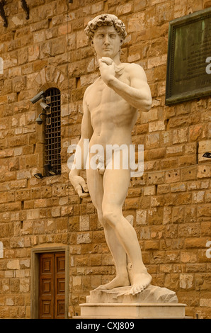 A copy of Michaelangelo's statue of David, stands in the original of location , in front of the Palazzo Vecchio in Florence Stock Photo