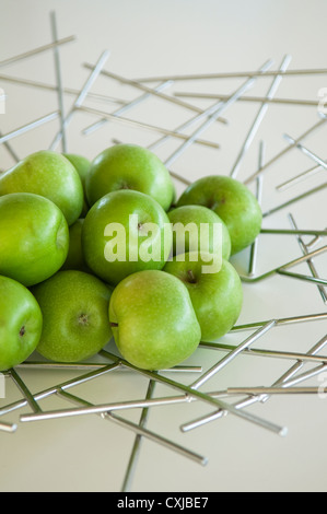 Fresh apples on steel designed fruitbowl Stock Photo