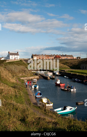 Ships moored at Seaton Sluice at high tide in Northumberland, England, UK Stock Photo