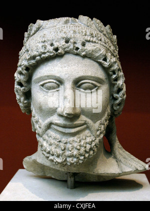 Head from a statue of a bearded man with laurel wreath. Limestone. Sculpted in Cyprus. British Museum. London. Stock Photo