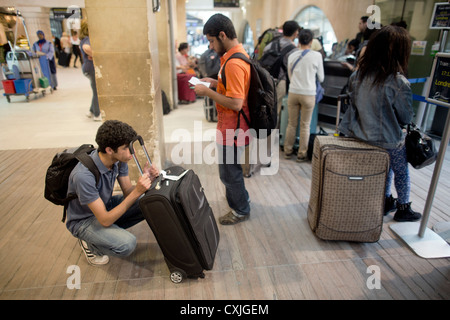 Passengers waiting for a Eurostar service at SNCF at Paris Gare du Nord railway station in France Stock Photo