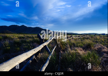 Late afternoon sun on the jack-rail fence at the Point of Rocks access to Silver Creek in Idaho Stock Photo