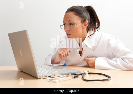 female doctor using laptop computer Stock Photo