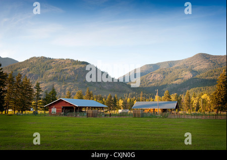 A western horse ranch nestled in the hills of the North Cascade Mountains along Highway 20 in eastern Washington State. Stock Photo