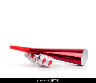 Red and white noisemakers on a white background on a white background Stock Photo