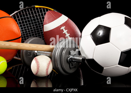 Various sports equipment on a black background Stock Photo