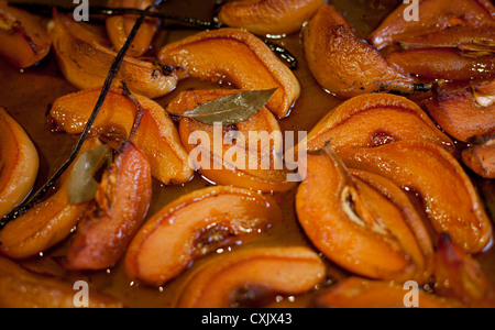 baked quince slices with bay leaves Stock Photo