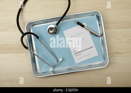 Stethoscope, Pen and Prescription on Medical Tray, Birmingham, Alabama, USA Stock Photo