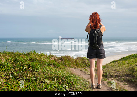 Backview of Woman Hiking and Looking at View, Ilha do Mel, Parana, Brazil Stock Photo