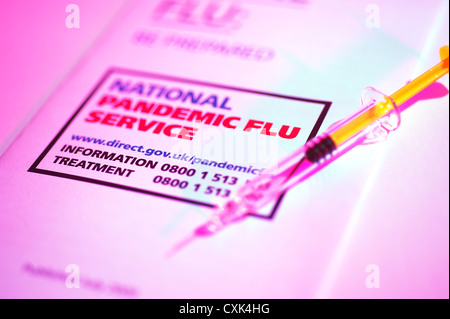 Swine Flu Be prepared National Pandemic Service UK government NHS leaflet with a needle and syringe of the flu vaccine Stock Photo