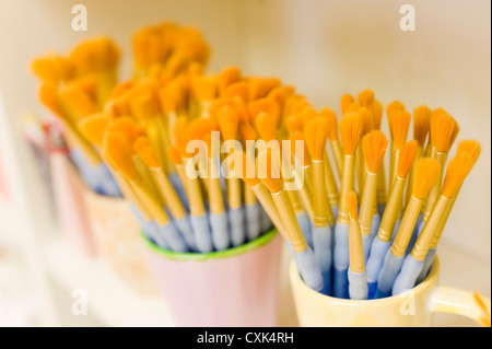 Paint Brushes in Cups Stock Photo