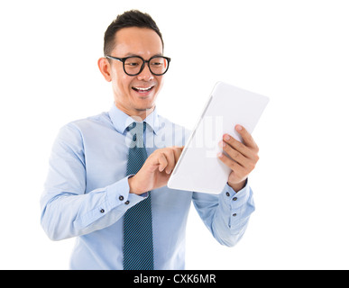 Handsome smiling Asian man with tablet computer. Isolated over white background Stock Photo