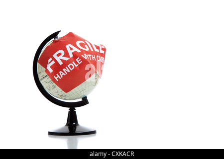 A globe with a red fragile sticker on a white background Stock Photo