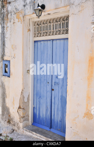 Old greek blue door  in the hill farming village of Kroustas, near Agios Nikolaos, Crete, Greece Stock Photo