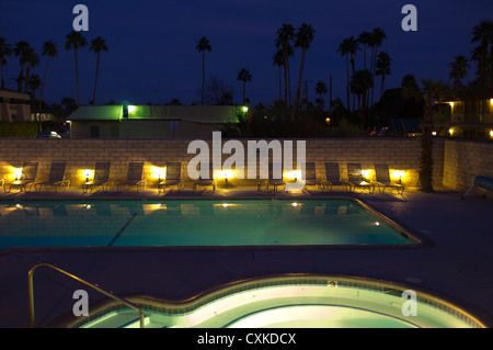 A hot tub and swimming pool in the night light. Stock Photo