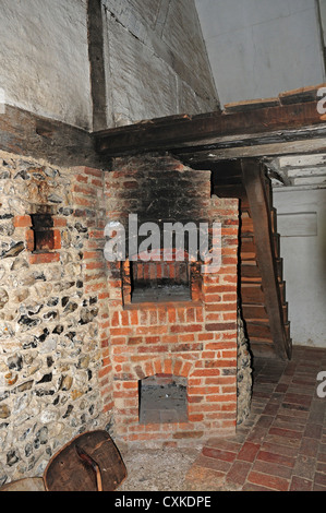 Bakehouse and bread oven in the 17th century cottage from Walderton. Weald and Downland Open Air Museum. Stock Photo