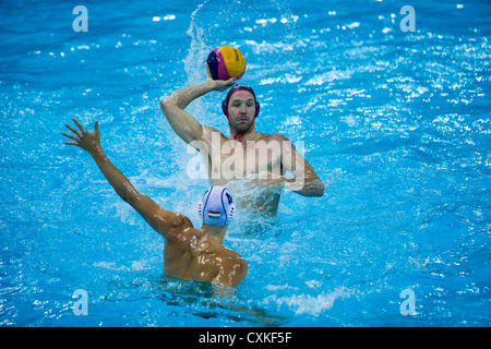 (USA) with the ball during the USA vs.Hungary Men's Water Polo game at the Olympic Summer Games, London 2012 Stock Photo