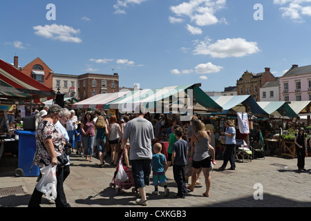 Chesterfield market square, Derbyshire England UK, crowded with shoppers. English market town stalls. Sunny Summer day Stock Photo