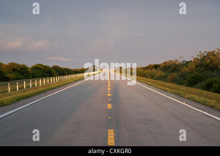 tamiami trail in the evening sun looking back to approaching thunderstorm florida everglades usa Stock Photo