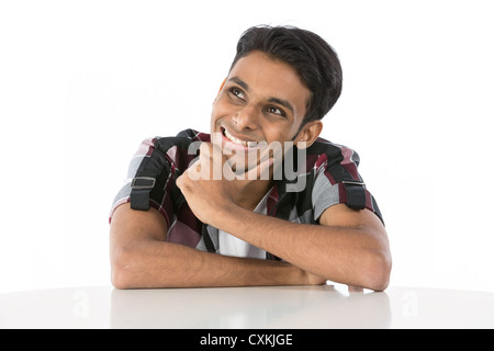 Happy Indian man looking up. Isolated on white background Stock Photo