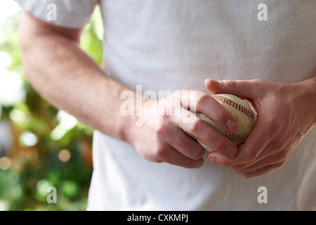 Man Holding Baseball Stock Photo