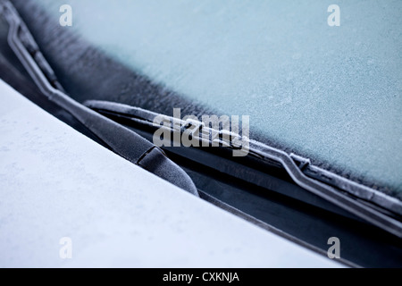 Icy car in winter, ice on the windscreen and the windscreen wipers Stock Photo