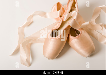 A pair of ballet shoes on a white background Stock Photo