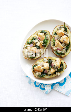 Stuffed Baked Potatos with Chicken, Cheese, Spinich and Onion Stock Photo