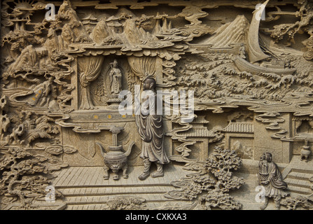 Guan Yin carved wooden paint in chinese temple Stock Photo