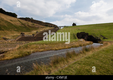 Overflow spillway at Butterley Reservoir, Marsden UK. A Grade II list structure replaced in concrete by the water company in 2016/17 Stock Photo